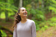 © Antonioguillem - Happy casual woman looking amazed in a forest