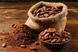 Cacao beans and powder on wooden table in burlap