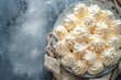 French meringue presented on a textured plate backdrop