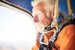 senior skydiver checking altimeter midair during descent