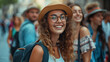 Joyful Young Woman Exploring City Streets, smiling young woman in a summer hat stands out in a crowd on a vibrant city street, embodying a spirit of youthful exploration and happiness