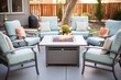 © studioworkstock - a set of aluminum patio furniture arranged around a gas fire table