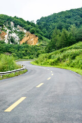 Canvas Print - Road turning in the hills