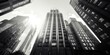 © Fotograf - A black and white photo showcasing tall buildings. Can be used for architectural projects or cityscape illustrations