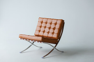 Orange leather chair on a white background.