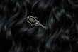 macro shot of an antique silver hairpin in dark curly hair