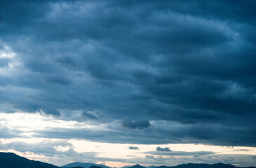 Wall Mural - Dark and dramatic storm clouds on the sky