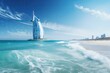 view of 7 star hotel burj al arab in dubai on the beach with incoming blue and white clean waves into the sand
