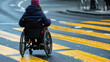 Handicapped or old woman in a wheelchair crossing the pedestrian lane amidst a bustling city background Quality of life and impairment concept.