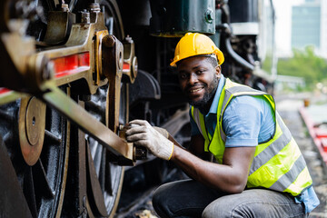 Wall Mural - Railway workers working with industrial machinery.