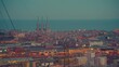 Establishing shot of Barcelona skyline from west to east. Barcelona city streets illuminated and Barcelona port at night. Night illumination barcelona city center traffic street aerial panorama Spain