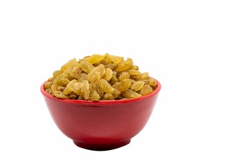 Wall Mural - Closeup of Golden Raisin in a Red Bowl Isolated on White Background with Copy Space