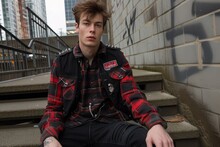 Fashion Model With Red And Black Flannel Shirt And Black Vest With Spikes
