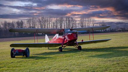 Wall Mural - Vintage passenger airplane on the ground. Biplane