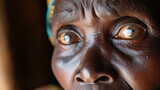 Fototapeta Sport - A close-up of a mothers worried face reflecting the struggle against hunger.