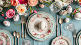 Fototapeta Uliczki - A flat lay of an Easter brunch table setting with decorative plates cutlery and napkins.