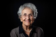 © Chris - portrait of a senior woman on solid black background