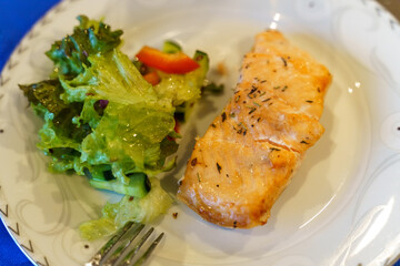 Wall Mural - Grilled salmon fillet and fresh green leafy vegetable salad. Healthy food.