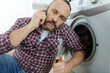 man on the phone washing machine problems