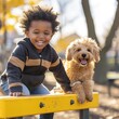 A joyful toddler and their loyal dog enjoy a sunny day at the playground, sitting on a yellow slide and surrounded by colorful trees, while dressed in cozy fall clothing and sharing a heartwarming sm