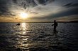 Sea trout angler in sunset scenery