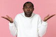 © zinkevych - Surprised black man wearing white sweatshirt shrugging shoulders
