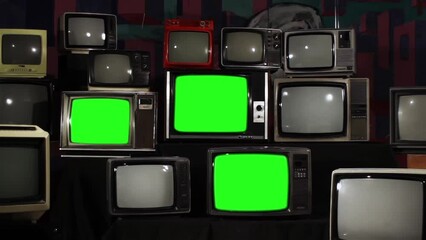 Wall Mural - retro televisions turning on green screen. zoom out. you can replace green screen with the footage o