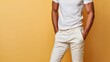 Back view of a man in casual white tee and beige pants