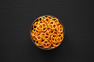 Wall Mural - Mini Pretzels with Salt in a Bowl, top view. Flat lay.