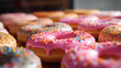 Tłusty Czwartek - pyszne lukrowane na różowo pączki i oponki z marmoladą. Smakowity upieczony donut. Dużo kalorii czyli jedzenie słodkich wypieków