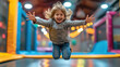 © Julia Zarubina - cheerful happy child jumping on a trampoline in a children's play center, kid, toddler, boy, girl, childhood, sport, active recreation, hobby, portrait, smile, emotional face, person, high, playground