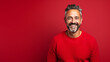 © FATHOM - Happy smiling middle aged adult man on a solid background