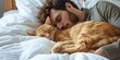 man sleeping in bed with cat