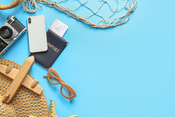 Sticker - Composition with modern mobile phone, beach accessories and passport on color background