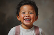 A close-up of a child's gleeful grin, featuring a mix of baby teeth and permanent teeth, symbolizing the innocence and charm of early smiles.