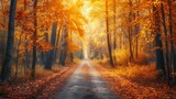 Fototapeta Las - A scene of an autumn woodland with a road covered in falling leaves and golden greenery illuminated by warm light.
