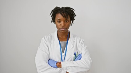 Canvas Print - Nervous, skeptic young black woman in labcoat and dreadlocks, frowning in upset over a problem, emanating negative vibes. all alone against a stark white wall. doubt seems to cloud her thoughts.