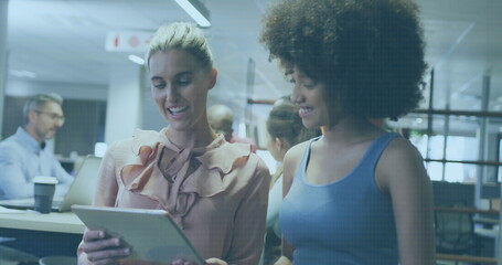 Canvas Print - Diverse businesswomen working in office