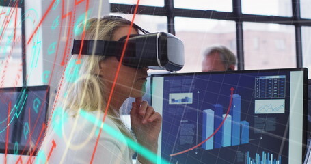 Canvas Print - Image of data processing over caucasian businesswoman using vr headset in office