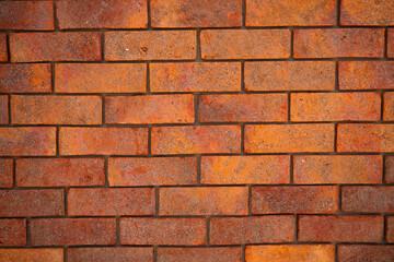 Red Textured Brick Wall Background with Old Cement Blocks and Brown Stone Pattern in Exterior Construction Architecture