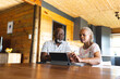 © Wavebreak Media - Senior african american couple doing paperwork using tablet at home