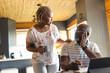 © Wavebreak Media - Senior african american couple doing paperwork using tablet at home