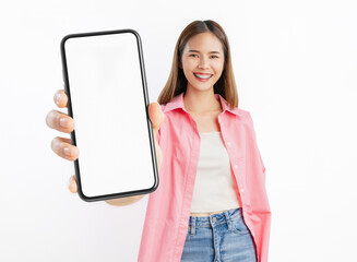 Beautiful Asian woman holding smartphone mockup of blank screen on white background.