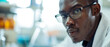 © Ai Studio - A pensive African-American man scientist in a lab, reflecting on his work