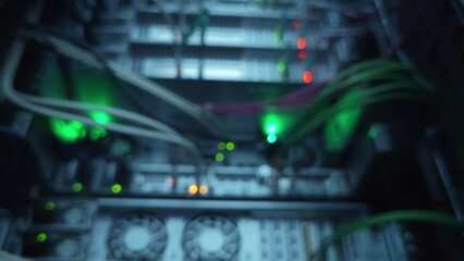 Server rack from bottom to top, camera in motion. Blurred server.