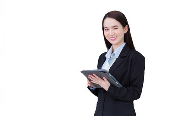 Asian professional working woman in black suit confidently holds tablet in hand and smiles in office roomwhile isolated on white background.