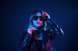 © standret - Cool young woman portrait in neon colors
