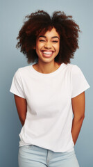Wall Mural - Young happy smiling African American woman model wearing tshirt standing on color background. Face skin hair care cosmetics makeup, fashion ads. Beauty portrait. White t-shirt mock up template .