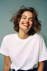 Wall Mural - young happy woman, smiling gen z girl model wearing tshirt looking at camera standing on color backg