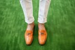 mens spring fashion coordinated with stylish loafers, fake grass as display floor